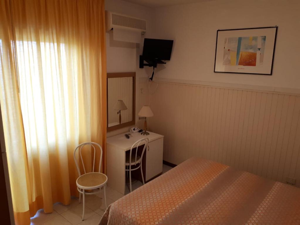 Postel nebo postele na pokoji v ubytování Albergo Ristorante da Settimio
