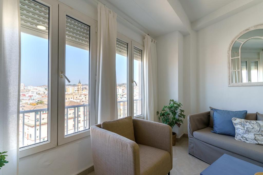 A seating area at Maisuit apartment Malaga city center
