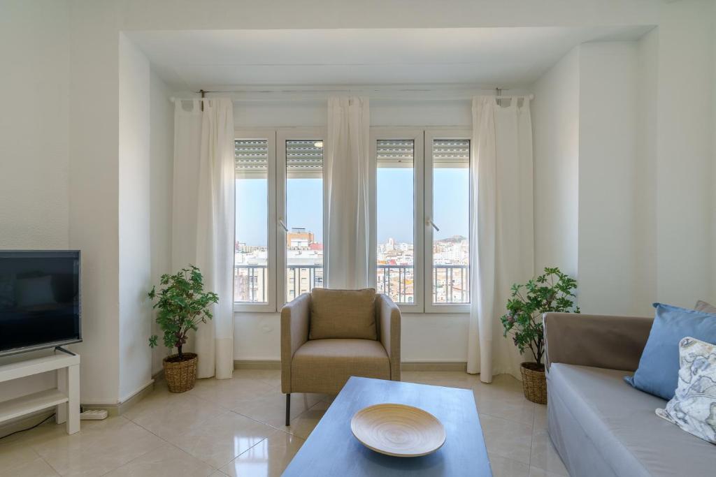 A seating area at Maisuit apartment Malaga city center