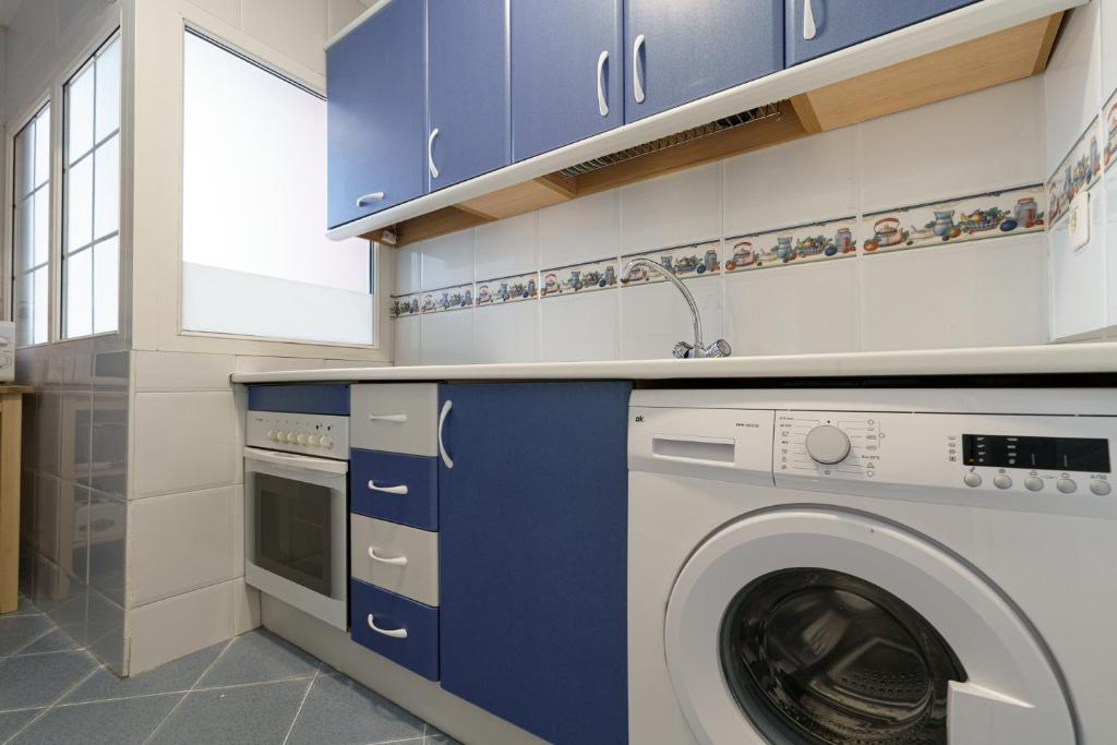 A kitchen or kitchenette at Maisuit apartment Malaga city center