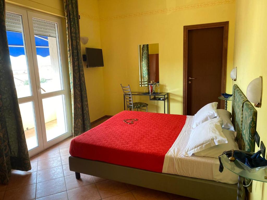 Postel nebo postele na pokoji v ubytování Hotel Villa Colombo