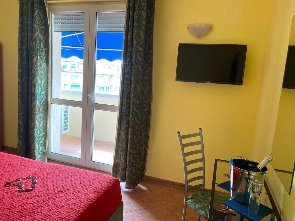 TV a/nebo společenská místnost v ubytování Hotel Villa Colombo