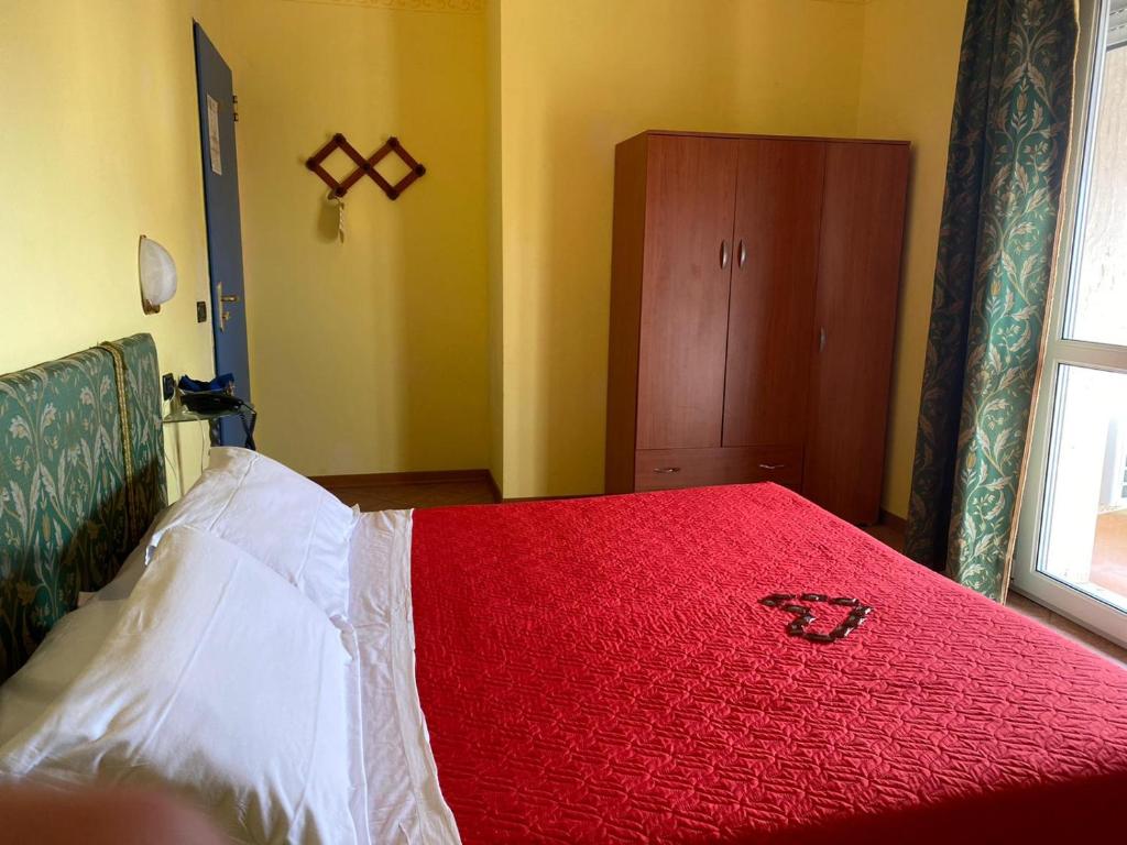 Postel nebo postele na pokoji v ubytování Hotel Villa Colombo