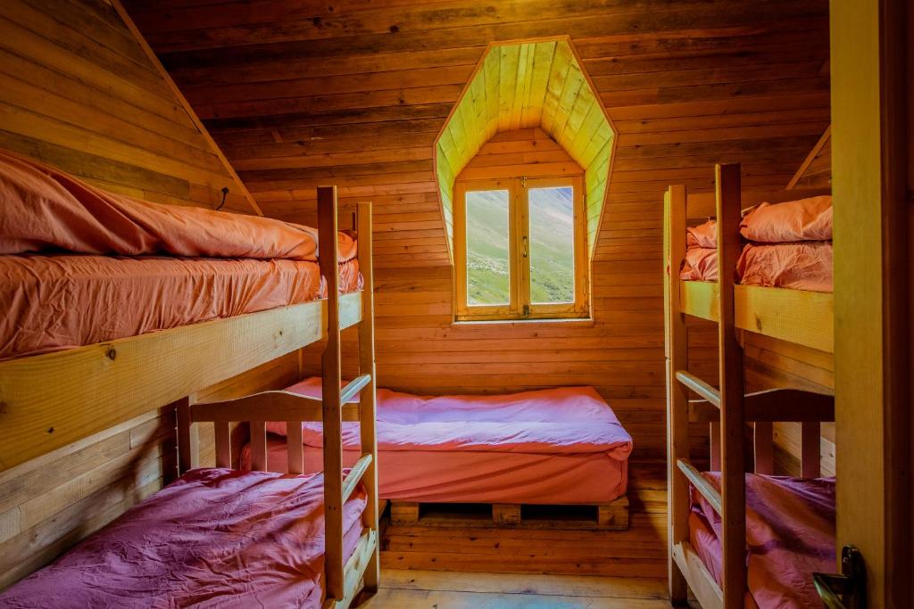 Postel nebo postele na pokoji v ubytování Fifth Season