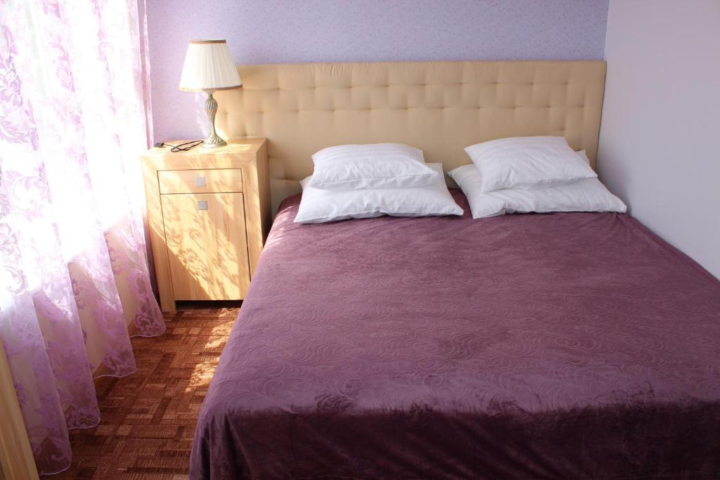 Postel nebo postele na pokoji v ubytování Villa & Restoran Soffa