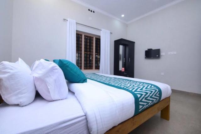 Postel nebo postele na pokoji v ubytování Wayal Wayanad Farm Resort