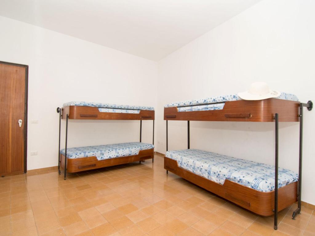 Łóżko lub łóżka w pokoju w obiekcie Apartment Ritamar by Interhome