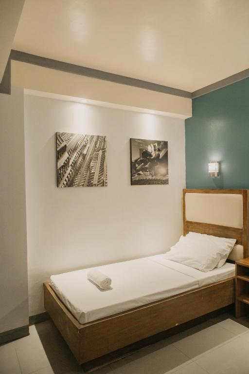 Postel nebo postele na pokoji v ubytování The Urban Pod Hotel