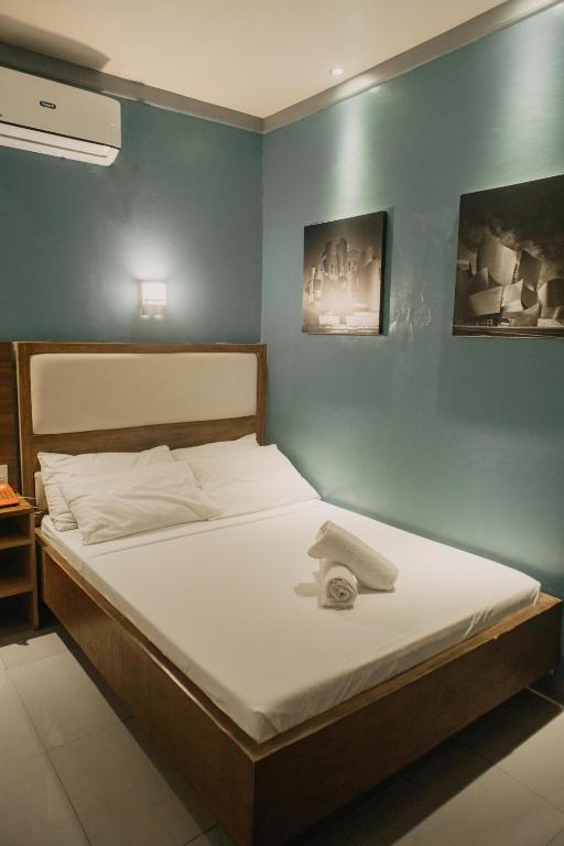 Postel nebo postele na pokoji v ubytování The Urban Pod Hotel