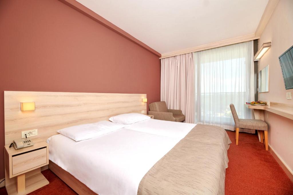 Postel nebo postele na pokoji v ubytování Hotel Materada Plava Laguna