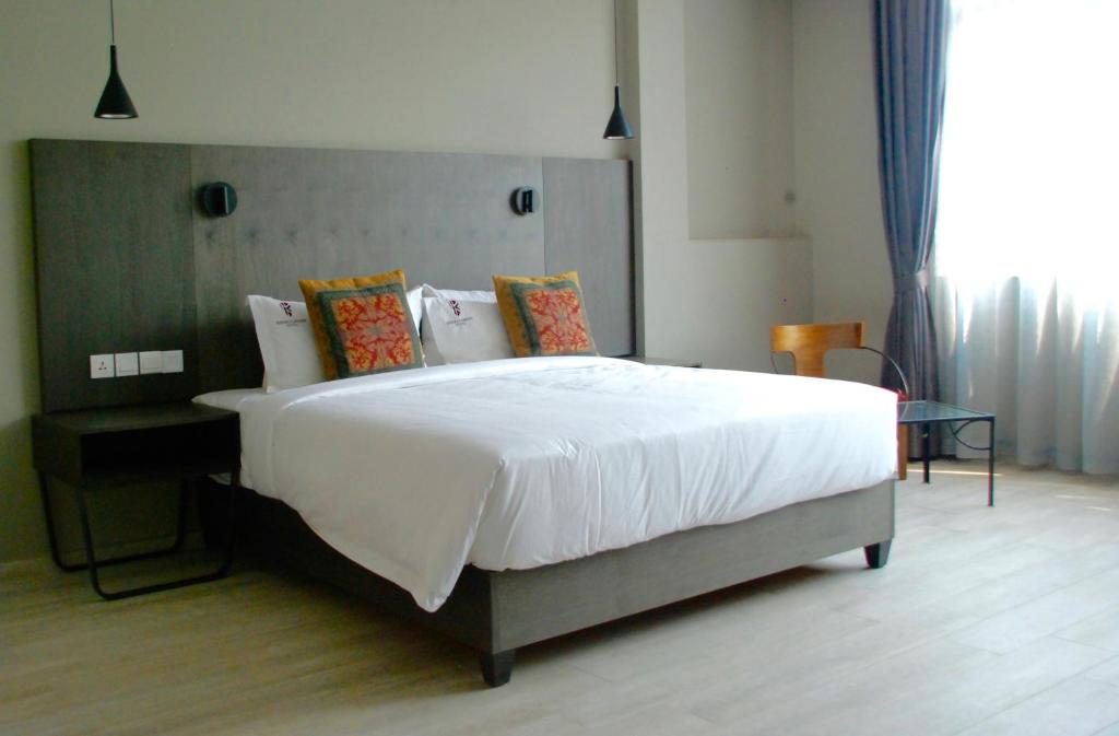 Kiriri Garden Hotelにあるベッド