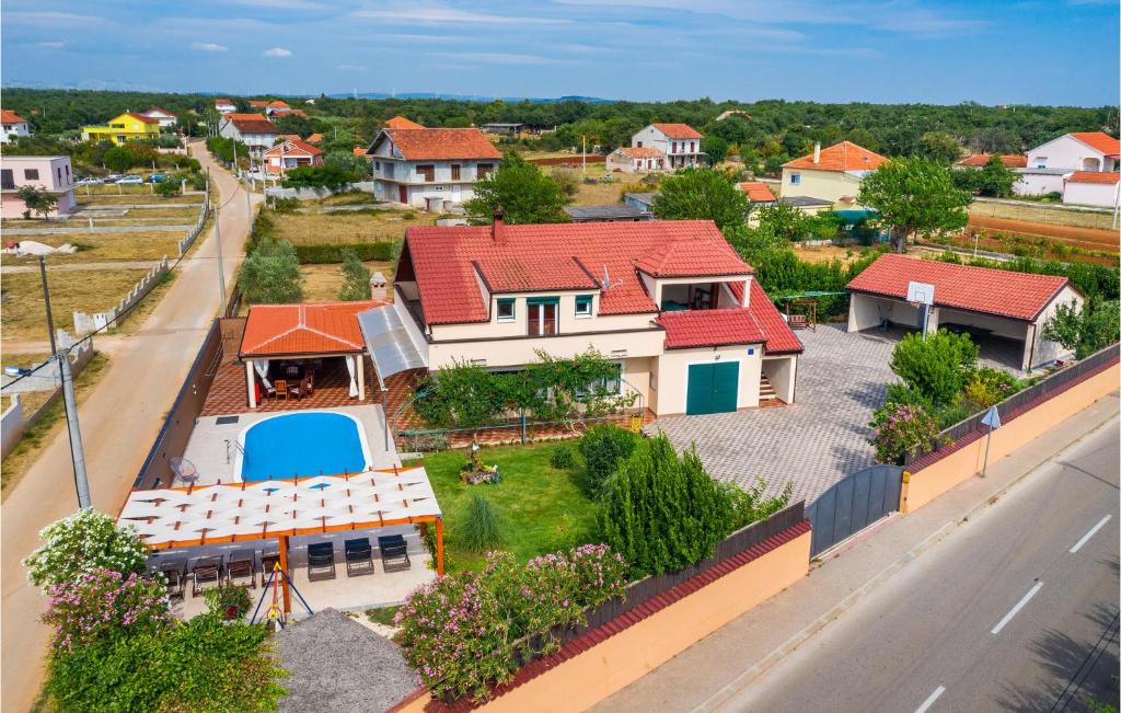 an aerial view of a house with red roofs at Amazing Home In Galovac With 6 Bedrooms, Wifi And Outdoor Swimming Pool in Galovac