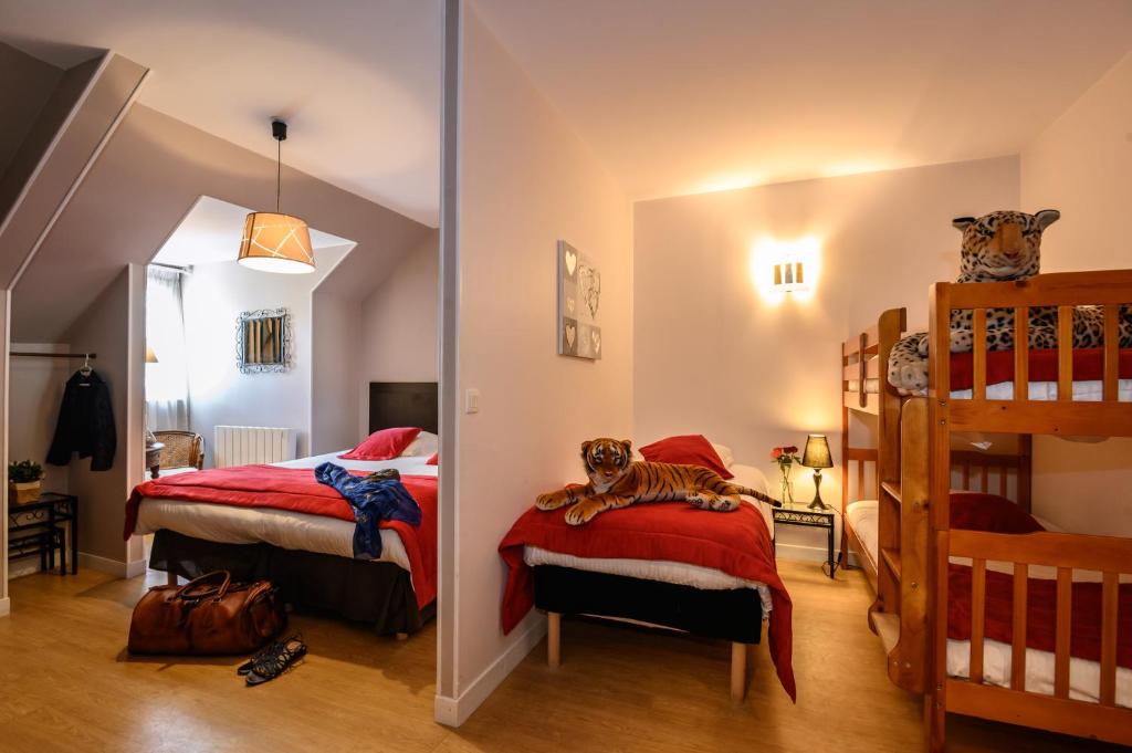 Postel nebo postele na pokoji v ubytování Hôtel Le Bayeux