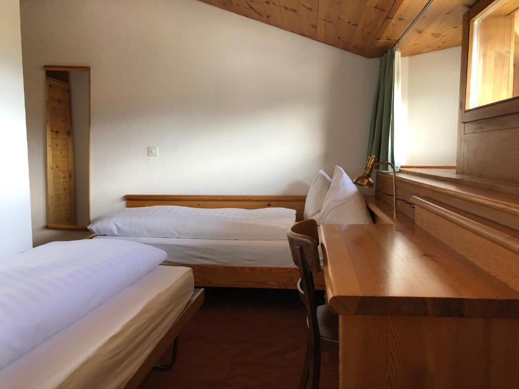 Postel nebo postele na pokoji v ubytování Arena Guesthouse