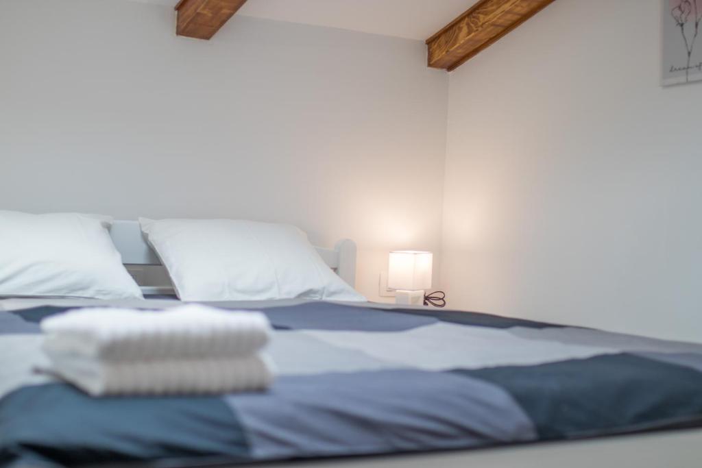 Postel nebo postele na pokoji v ubytování Apartmani Mario