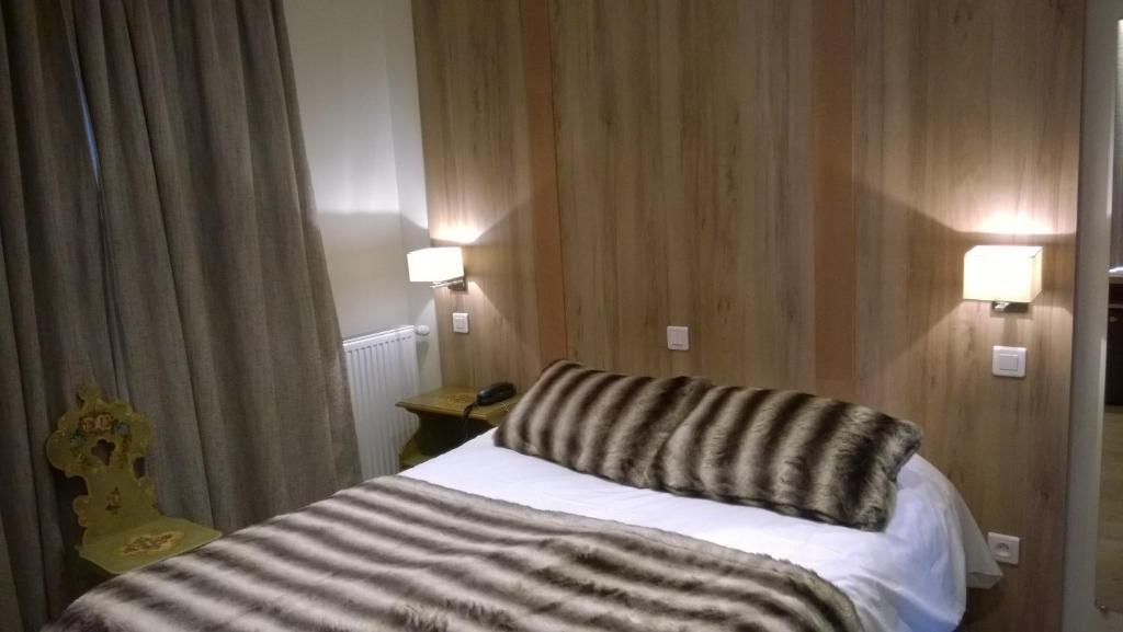 Postel nebo postele na pokoji v ubytování Hôtel Vallée Blanche