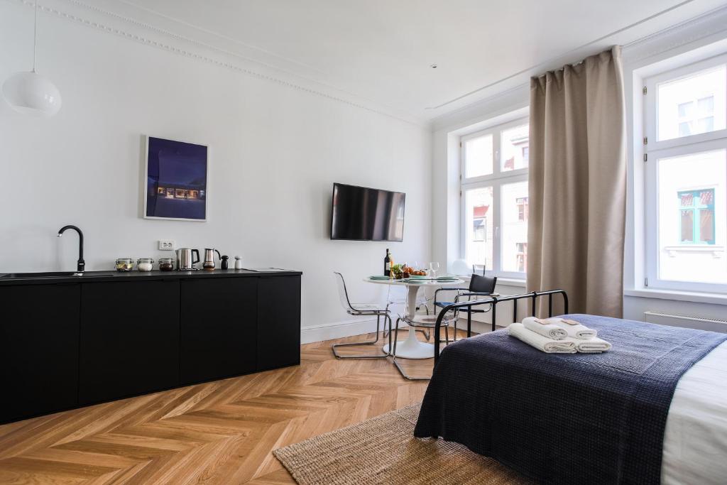 Televízia a/alebo spoločenská miestnosť v ubytovaní Apartment Copernicus No. 25