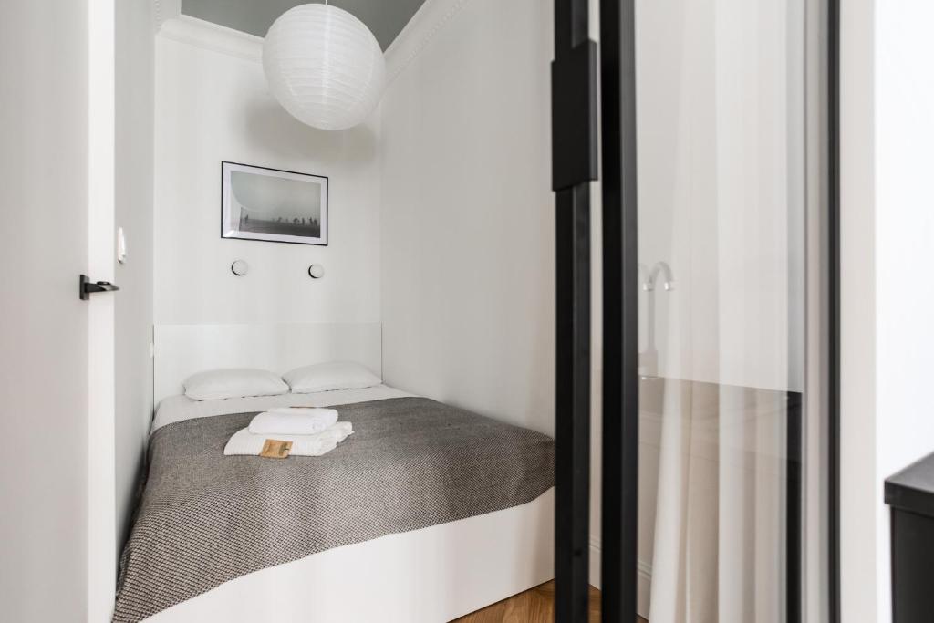 Posteľ alebo postele v izbe v ubytovaní Apartment Copernicus No. 25