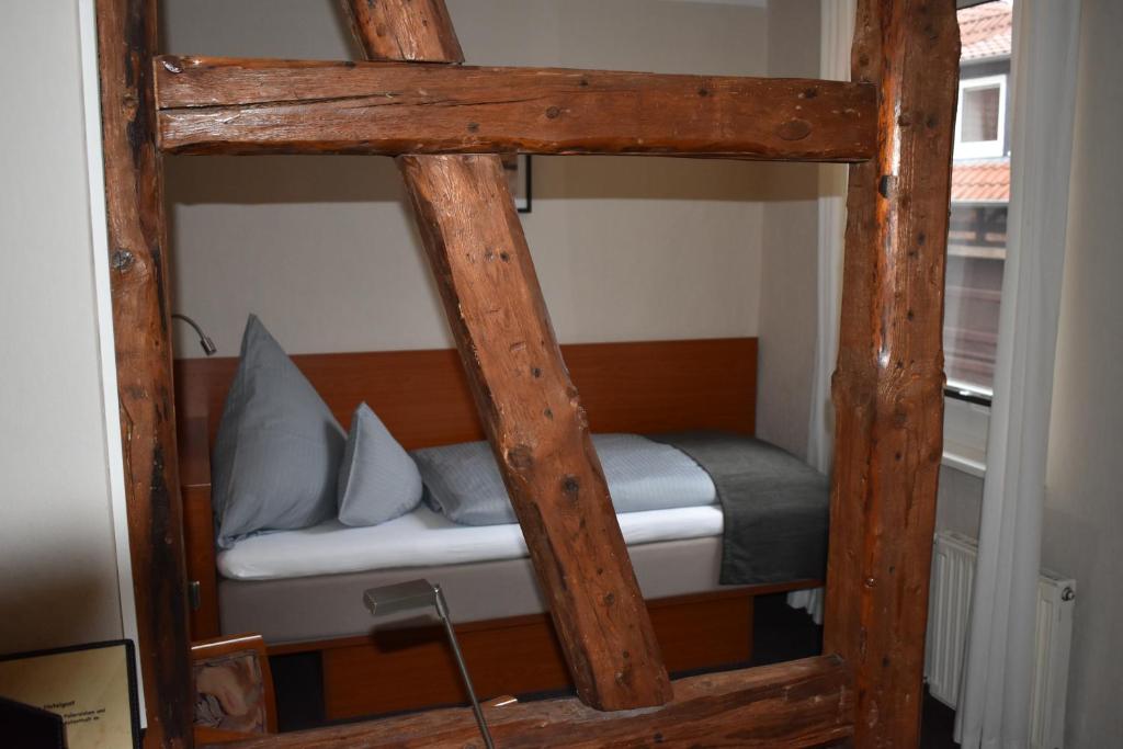 Postel nebo postele na pokoji v ubytování Hotel Neue Stuben