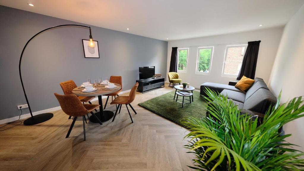 a living room with a couch and a table at Spacious 65m2 Apartment in the Centre of Eindhoven in Eindhoven