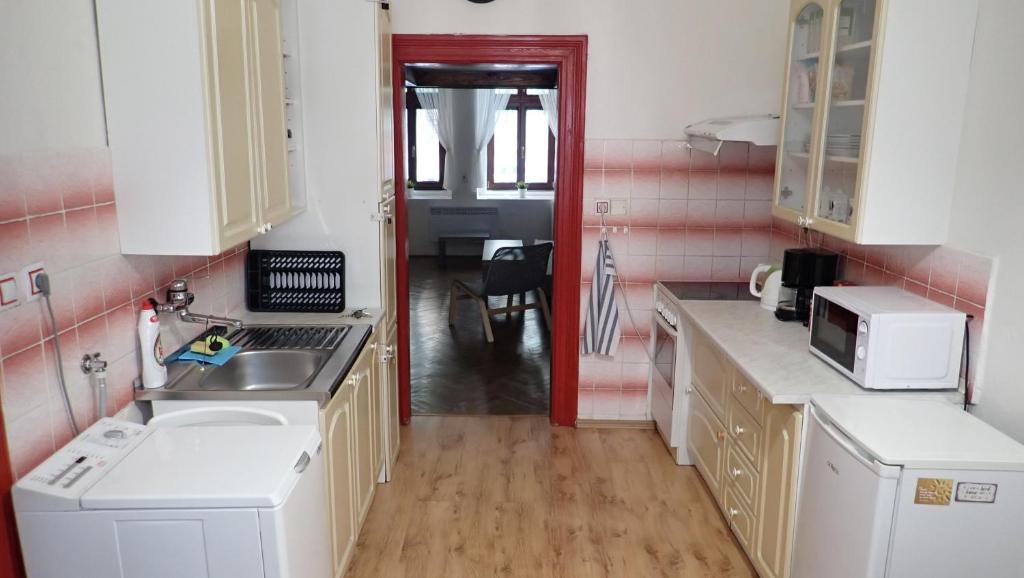 Kuchyň nebo kuchyňský kout v ubytování Apartment Jackie