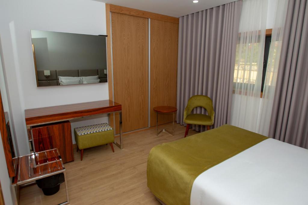 Postel nebo postele na pokoji v ubytování Hotel Fafense