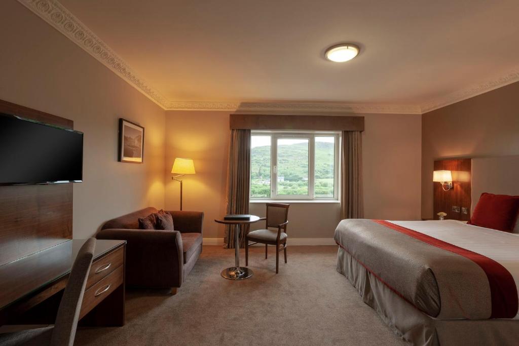 Postel nebo postele na pokoji v ubytování Carrickdale Hotel & Spa