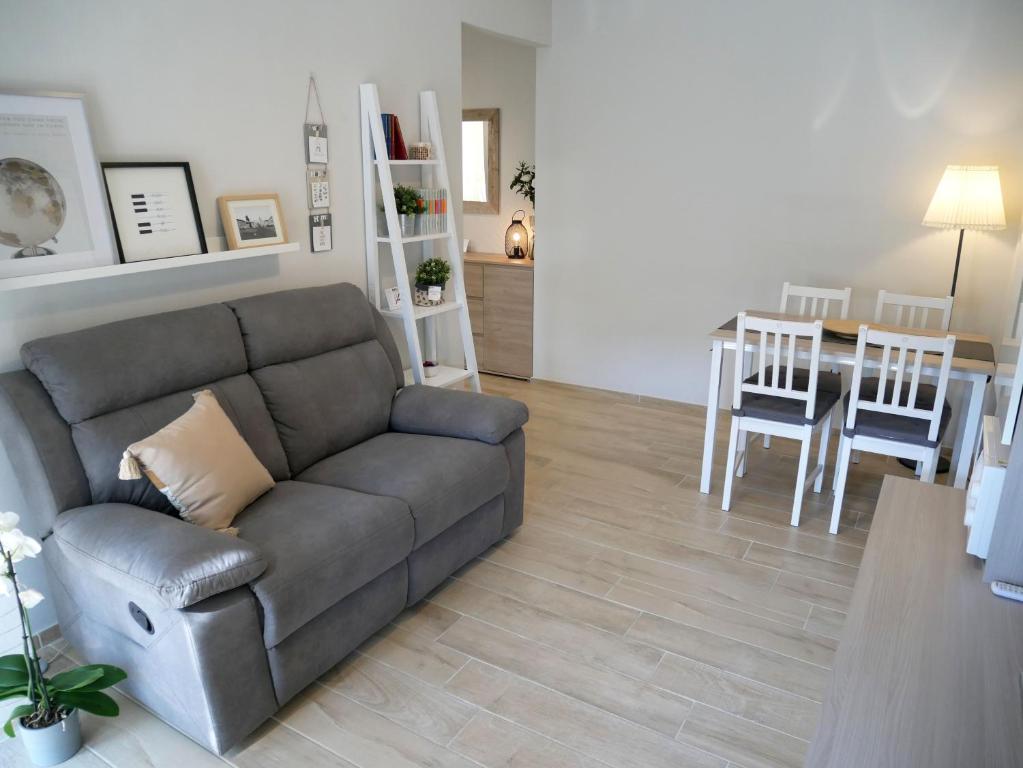 a living room with a couch and a table at Flat 61 in Turin