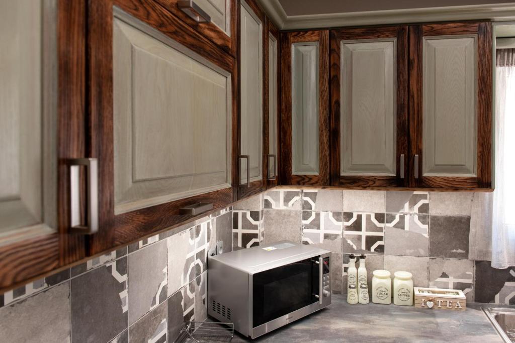 Kuchyň nebo kuchyňský kout v ubytování Aria apartment in the heart of Corfu city