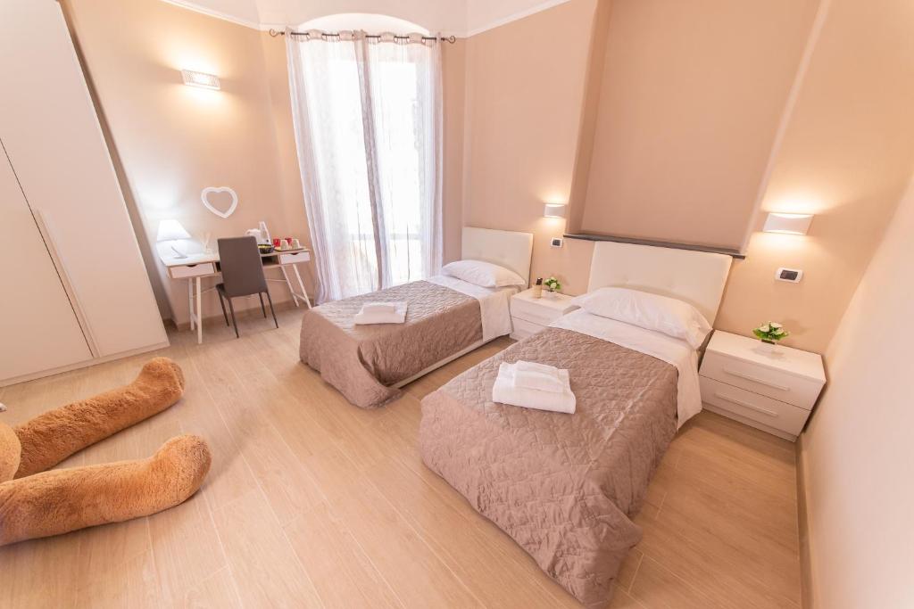 Postel nebo postele na pokoji v ubytování Le Camere di Teo 2