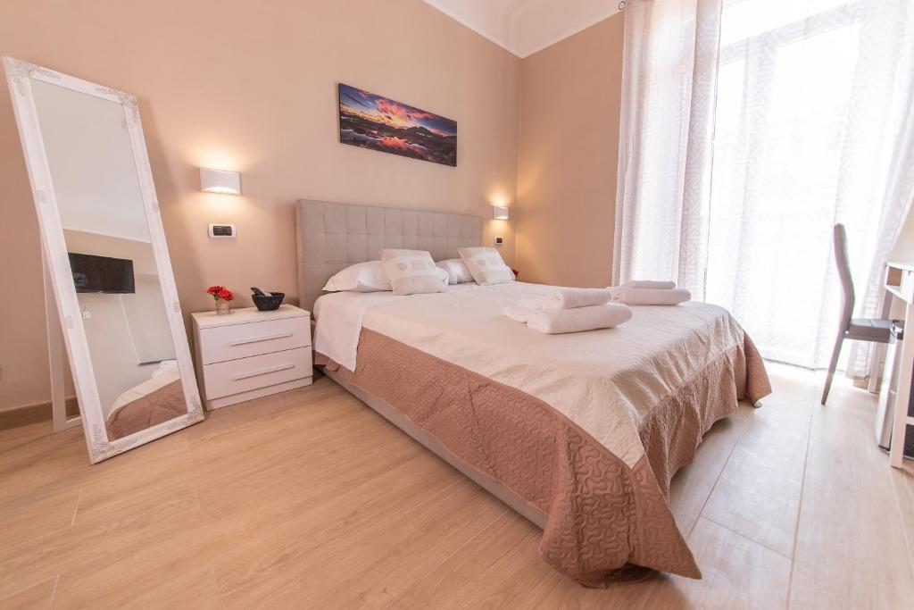 Postel nebo postele na pokoji v ubytování Le Camere di Teo 2