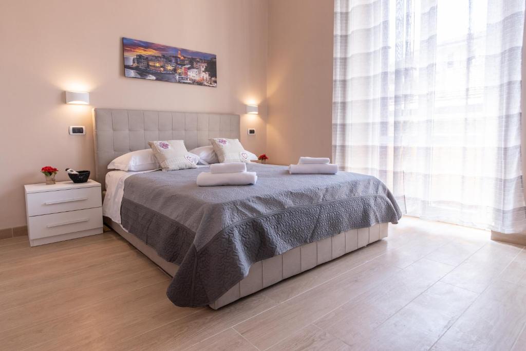 Postel nebo postele na pokoji v ubytování Le Camere di Teo 2