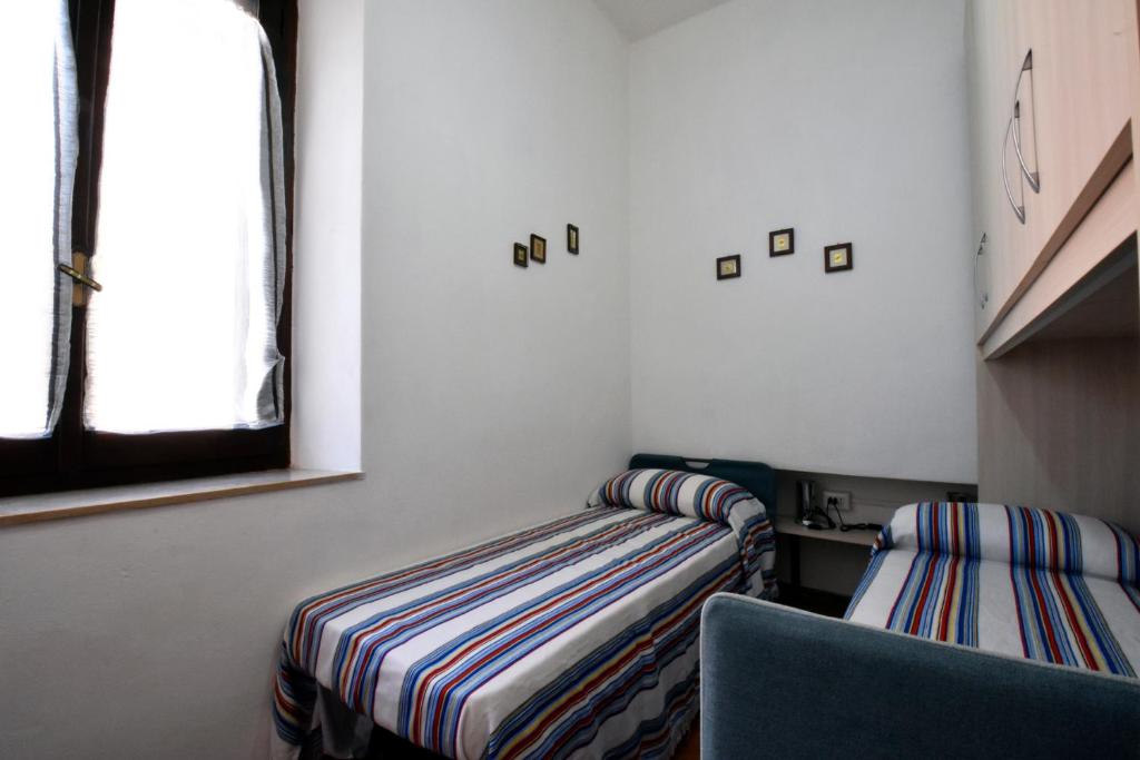 Posteľ alebo postele v izbe v ubytovaní La casa di Nonno