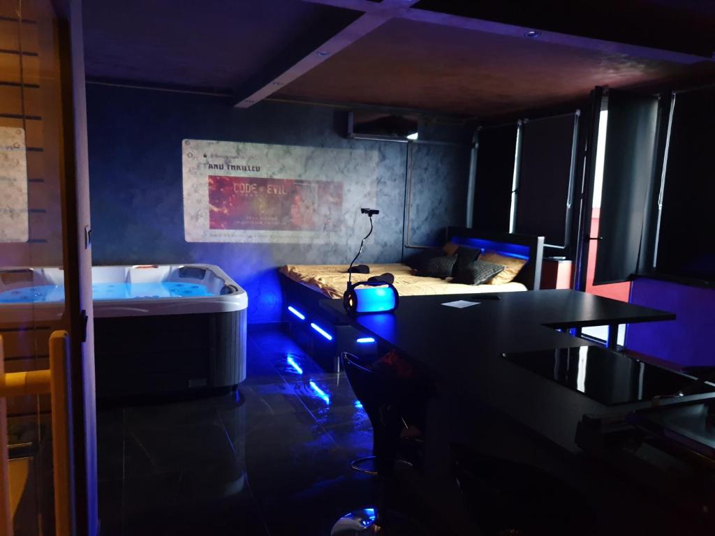 een kamer met een bed en een tafel met blauwe verlichting bij Wellness&Spa Zagreb in Zagreb