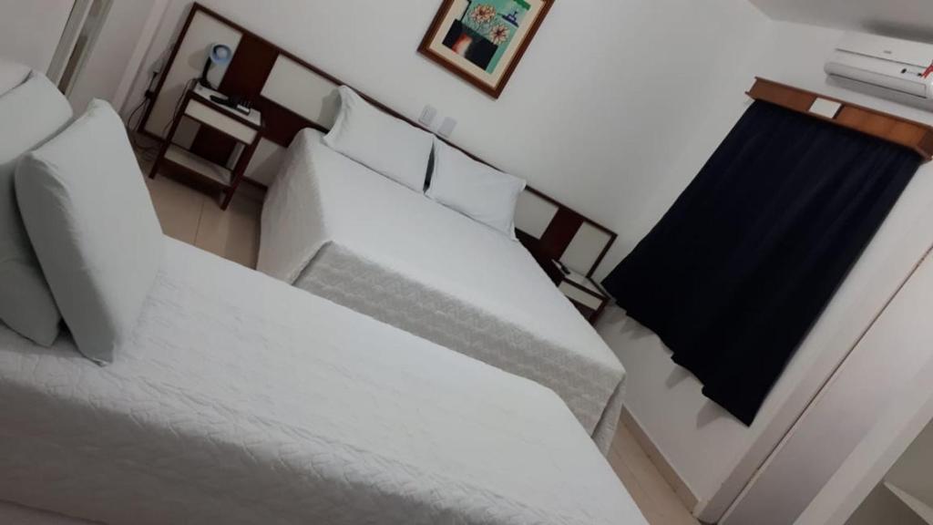 Postel nebo postele na pokoji v ubytování Shalako Hotel