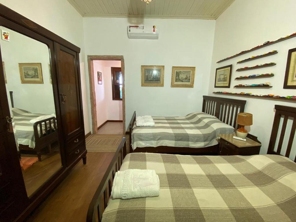 Postel nebo postele na pokoji v ubytování Pousada Fazenda Pinhalzinho