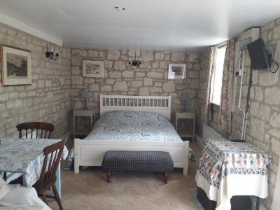 Ένα ή περισσότερα κρεβάτια σε δωμάτιο στο The Barn @ Hillside