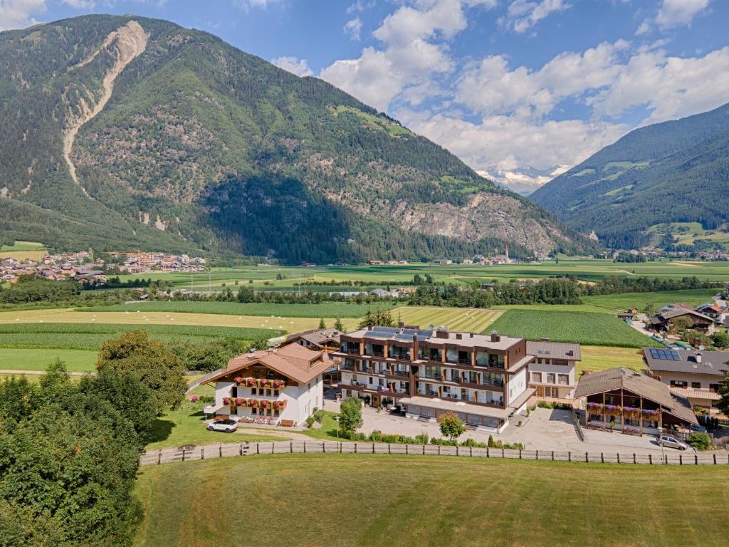 an aerial view of a resort in the mountains at Hotel Mair in Campo Tures