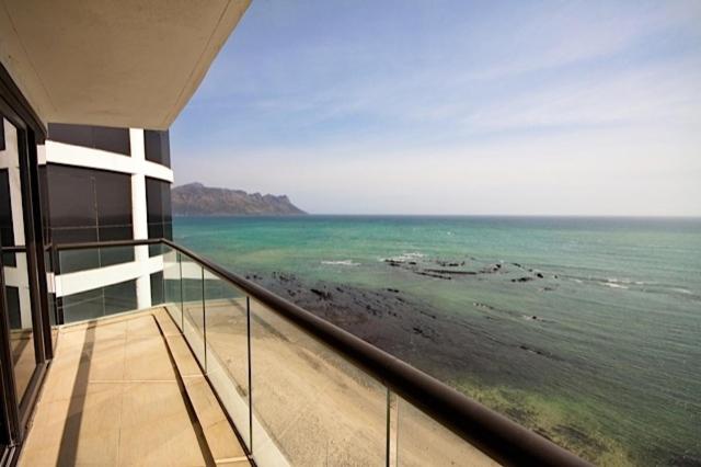 a view of the ocean from the balcony of a building at 1102 Ocean View in Strand