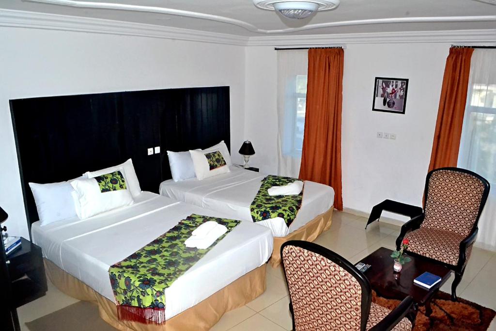 Ένα ή περισσότερα κρεβάτια σε δωμάτιο στο Hotel BKBG