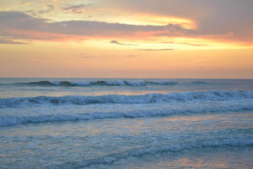 an image of the ocean at sunset at Island House Beach Resort 9 in Siesta Key
