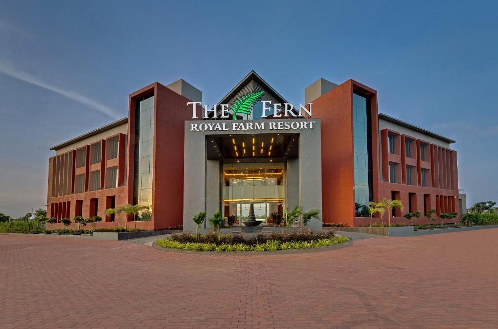 a building with a sign that reads the fern koto farm resort at The Fern Royal Farm Resort, Anjar in Anjār