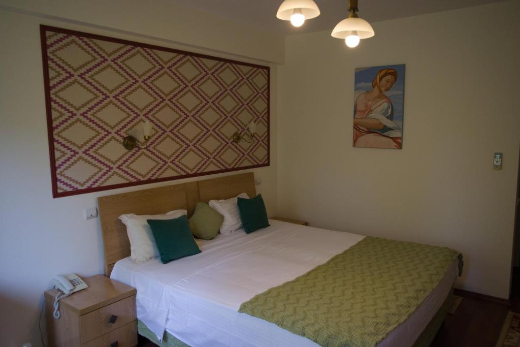 Postel nebo postele na pokoji v ubytování Hotel Michelangelo