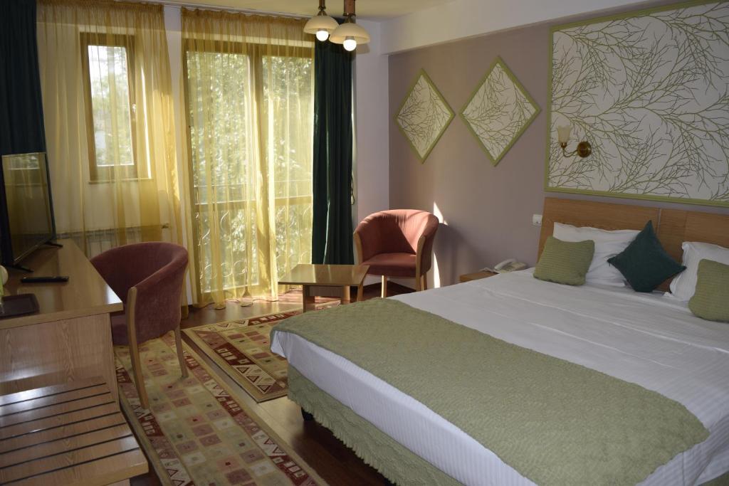 Postel nebo postele na pokoji v ubytování Hotel Michelangelo