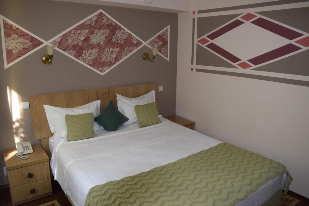 Postel nebo postele na pokoji v ubytování Hotel Michelangelo