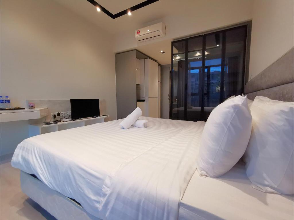 Postel nebo postele na pokoji v ubytování ExpressionZ Suites KLCC