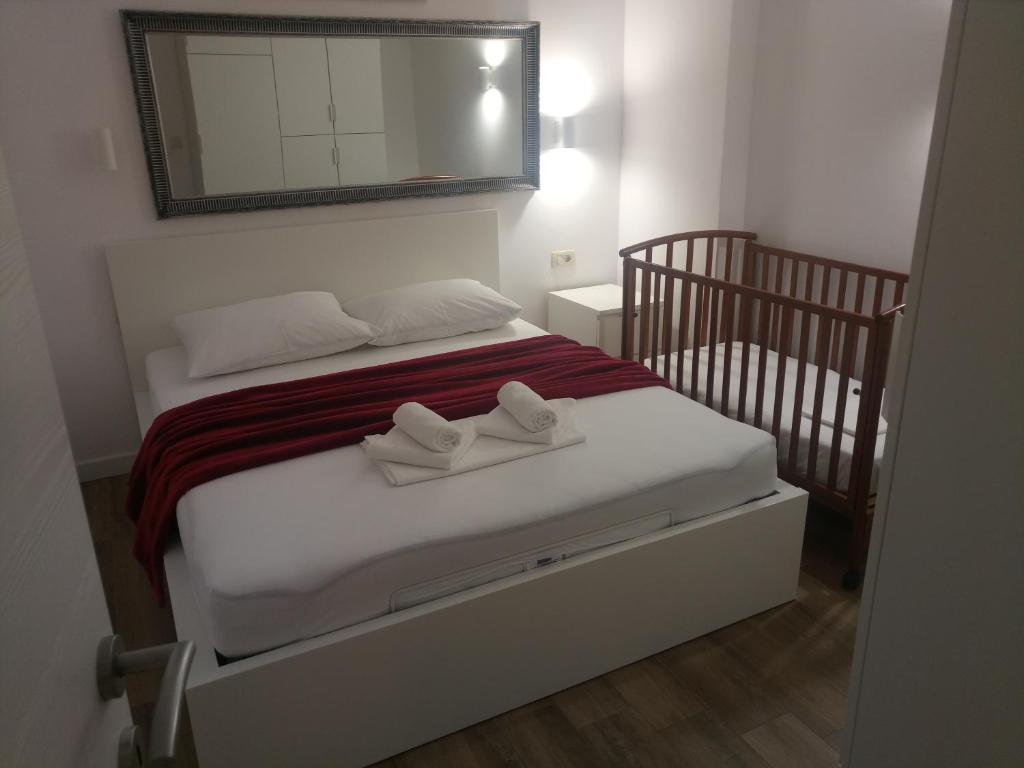 Postel nebo postele na pokoji v ubytování APARTMANI KUJUNDŽIĆ