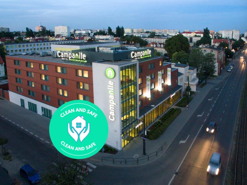 a building with a sign in front of a street at Campanile Bydgoszcz in Bydgoszcz