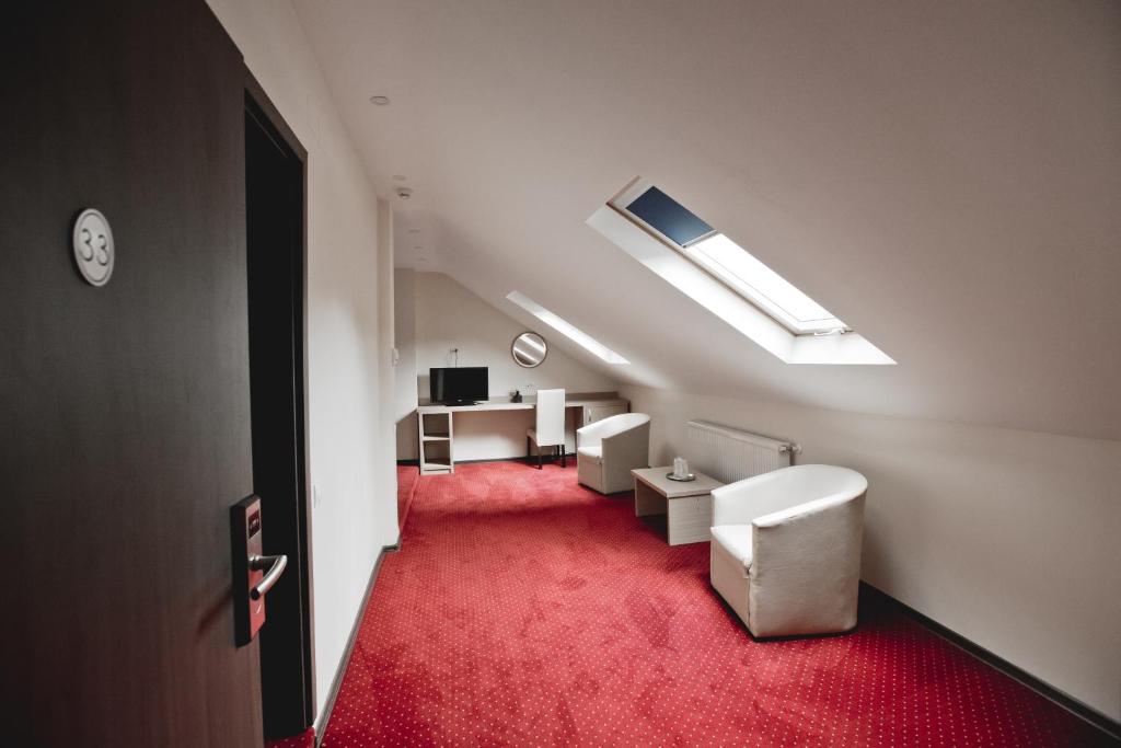 TV a/nebo společenská místnost v ubytování Hotel Evergreen