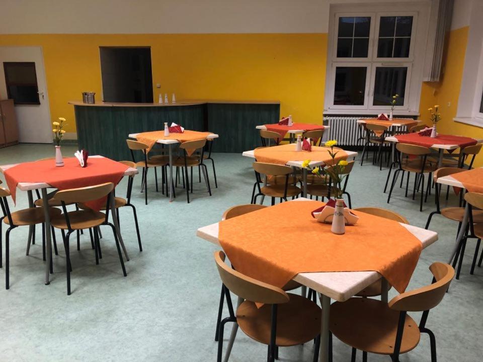 a group of tables and chairs in a room at Ryś Słoneczna Góra in Karpacz